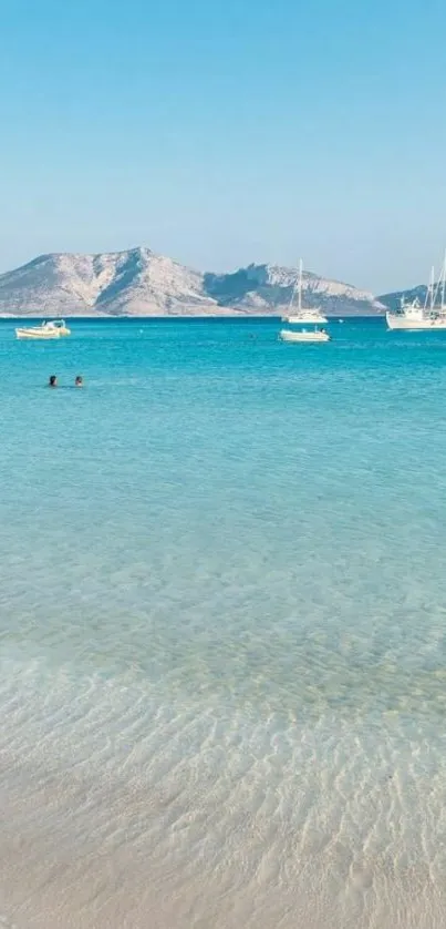 Beach wallpaper with turquoise sea and mountains.