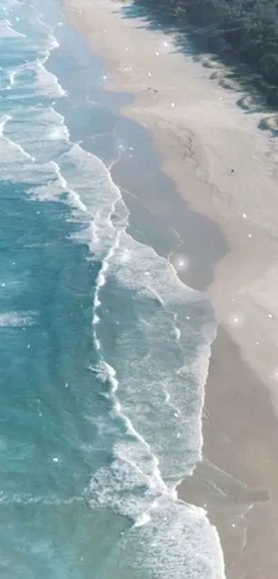 Aerial view of tranquil beach and ocean waves on a sunny day.