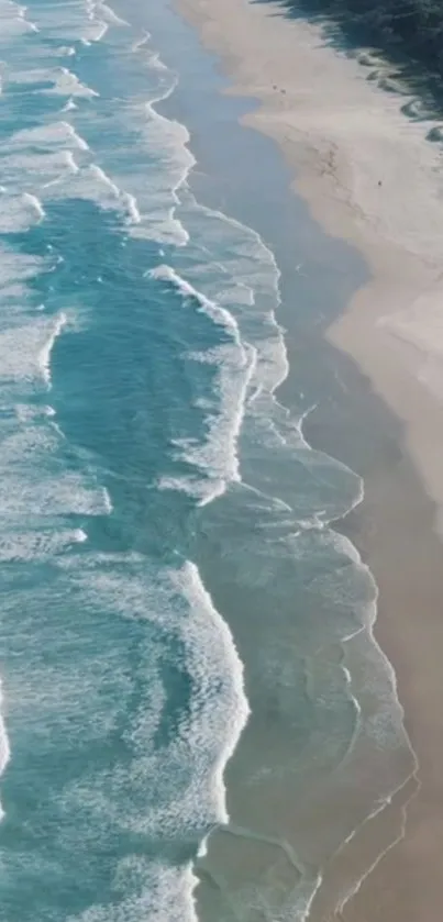 Aerial view of tranquil ocean waves on a sandy beach, perfect for phone wallpaper.