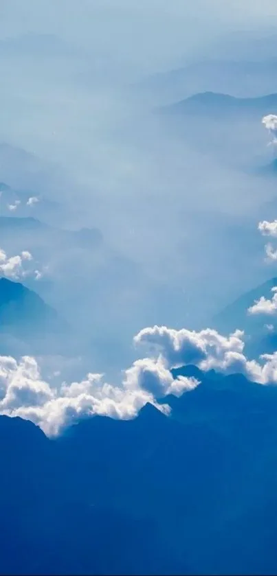 Scenic view of blue mountains and clouds creating a peaceful mobile wallpaper.