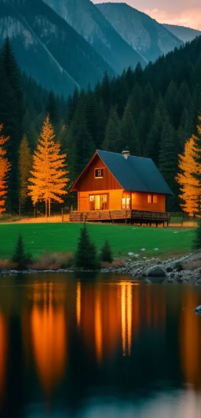 Cabin by a lake at sunset with autumn trees and mountains.