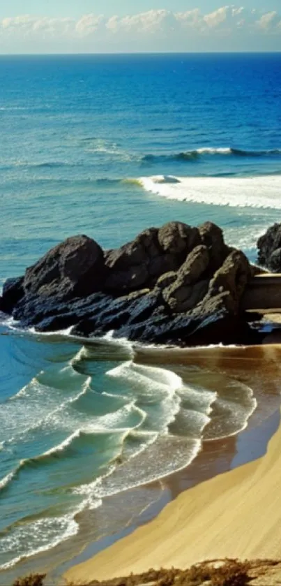 Coastal view with waves and rocky beach.