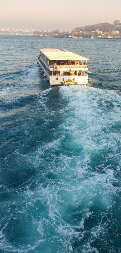 Ferry sailing on vibrant blue sea with scenic backdrop.