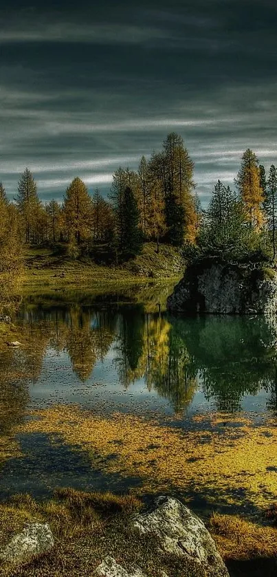 Serene autumn forest lake with reflections under dramatic sky.