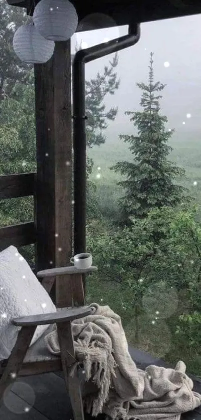 Cozy chair on porch overlooking misty forest landscape.