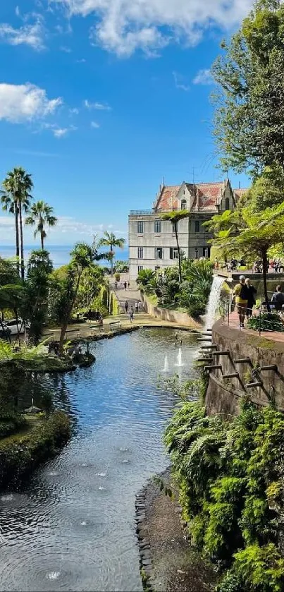 Serene garden with villa, river, and lush greenery under a blue sky.