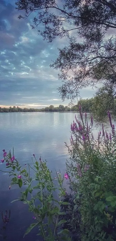 Serene lake scene at dusk with vibrant sky and tranquil waters.