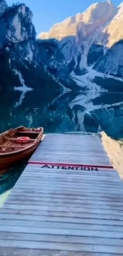 Peaceful lake with mountains and a dock.