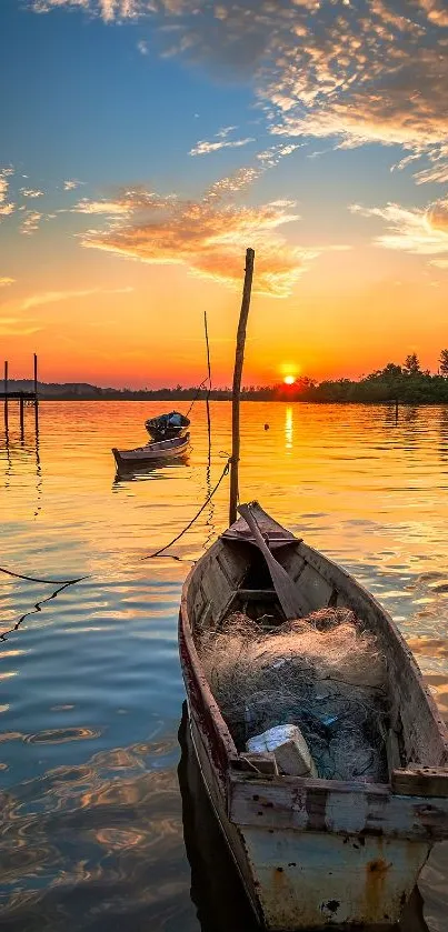 A serene sunset over a lake with boats, reflecting vibrant orange hues.