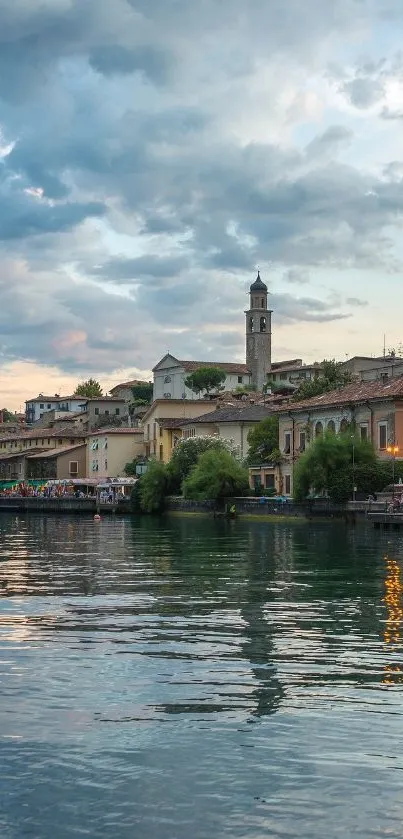 Tranquil village by the lake at sunset with reflections.