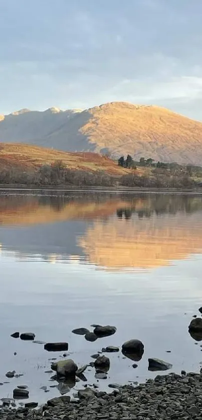 Tranquil morning lake reflection with mountains.