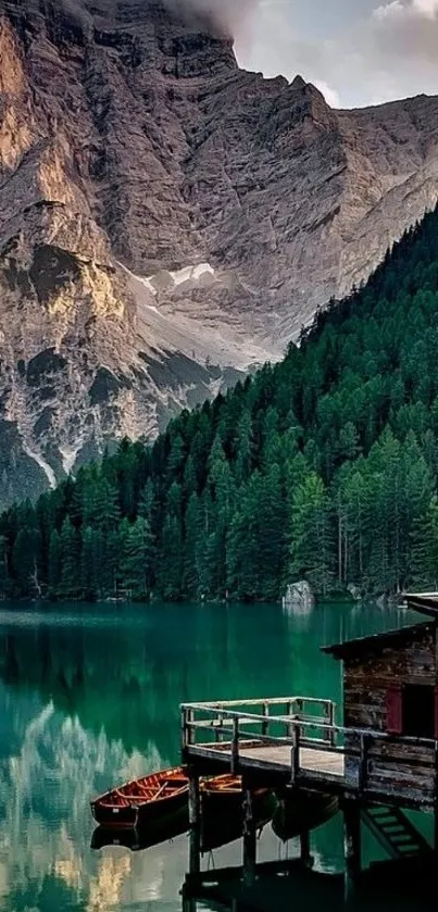 Tranquil mountain lake with cabin and forest reflecting on water.