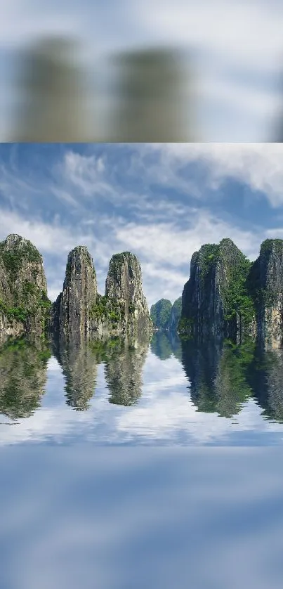 Mountainous landscape with tranquil lake reflection under a blue sky.