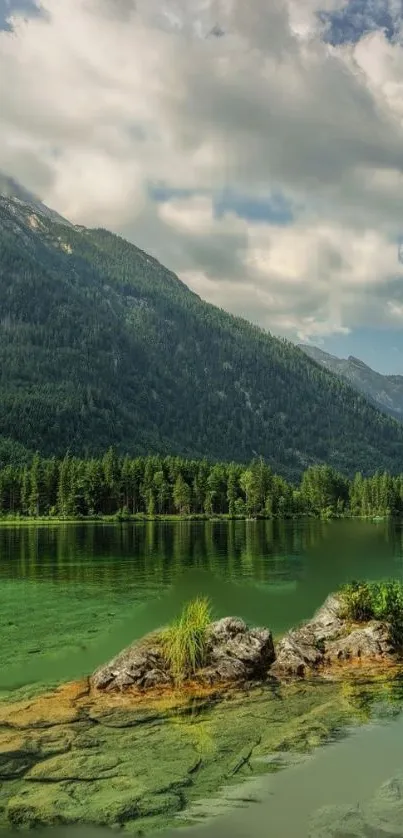 Tranquil mountain lake with lush greenery and calm waters.