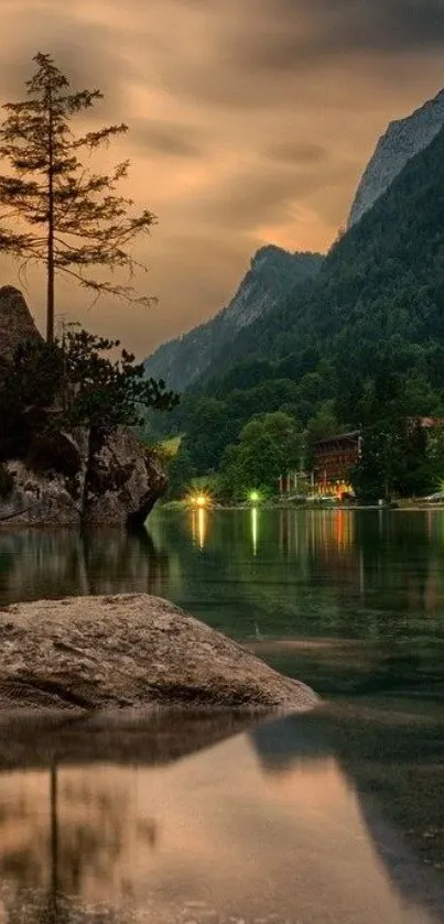 Serene mountain lake scene at sunset with reflections and greenery.