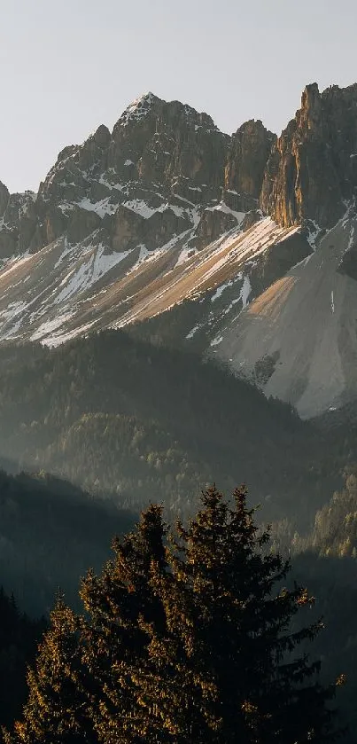 Serene mountain landscape at sunrise with forested hills.