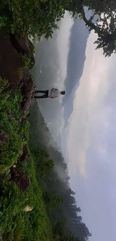 A tranquil view of misty mountains with lush greenery.