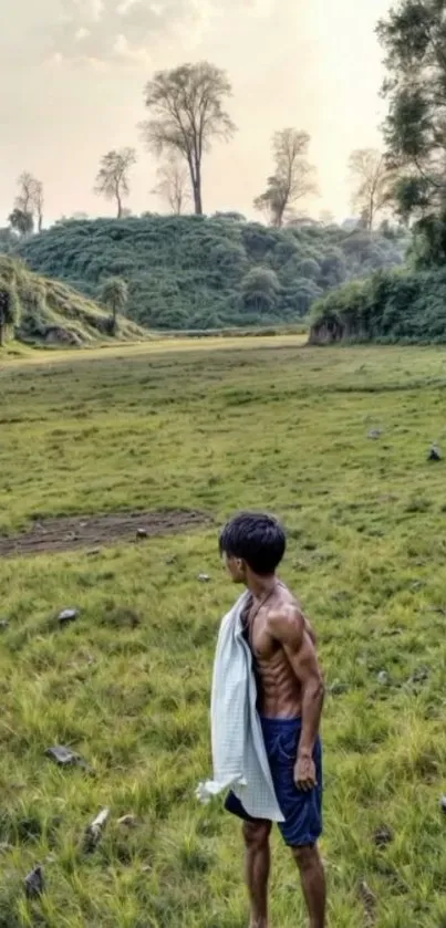 Man standing in serene open landscape