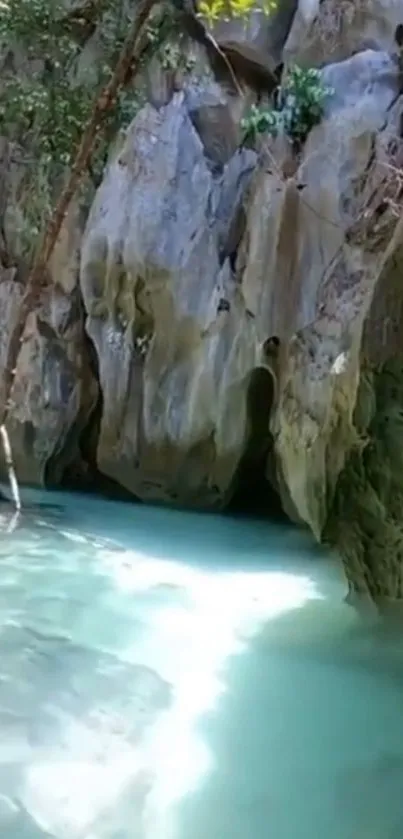 Serene waterfall scene with turquoise water and lush greenery.