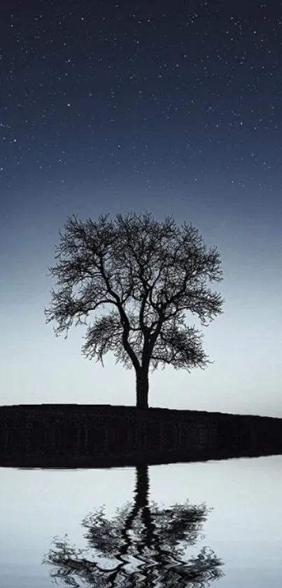 Lone tree reflected on lake under starry night sky.