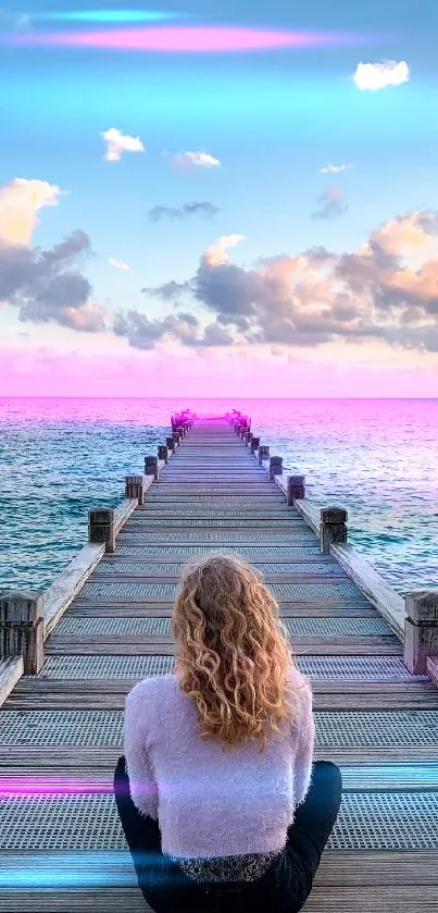 Person seated on dock overlooking tranquil ocean with cloudy sky.