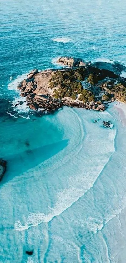 Aerial view of ocean island and beach with tranquil blue waters.