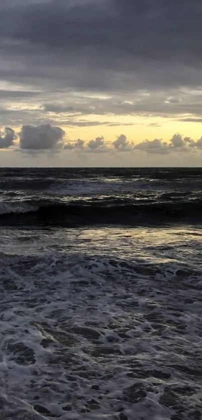 A tranquil ocean sunset with calm waves and a golden sky.