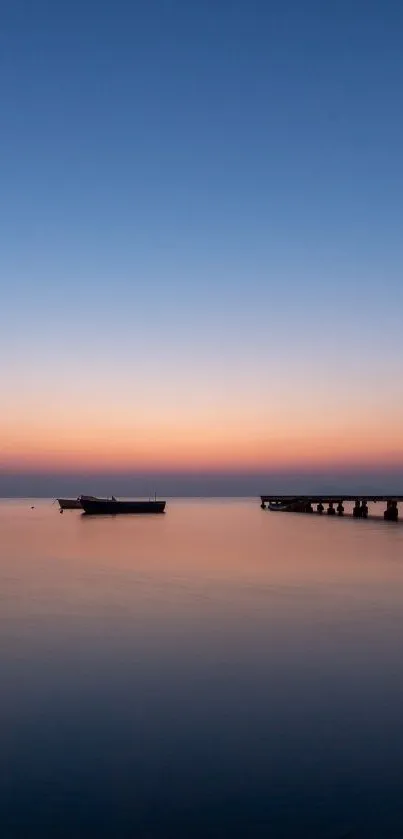 Calm ocean sunset with a pier and boat, perfect for a tranquil wallpaper.