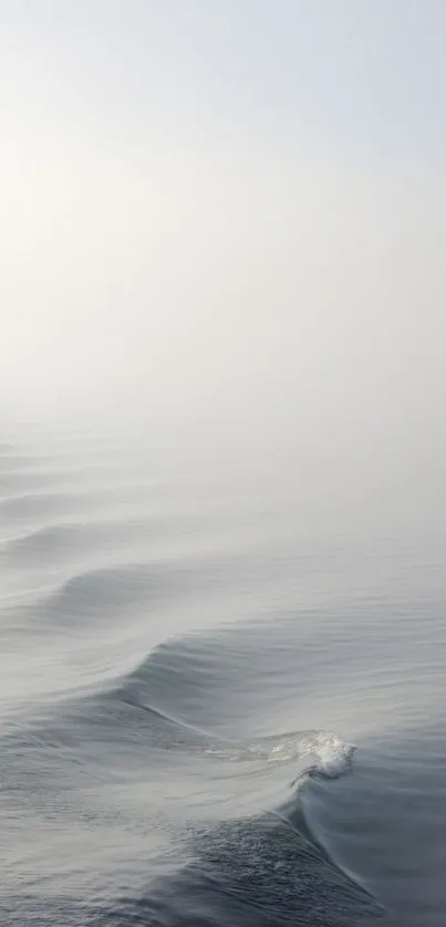 Serene ocean waves in soft grey hues for a minimal mobile wallpaper.