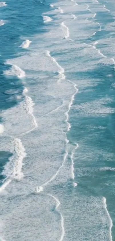 Tranquil ocean waves on a beach creating a serene mobile wallpaper.