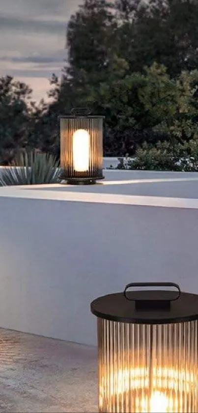 Outdoor lanterns casting a warm glow at dusk on a tranquil patio setting.