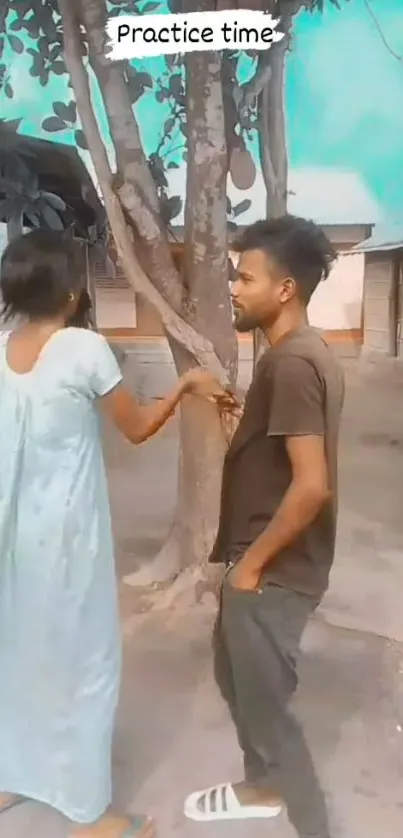 Two people practicing outside under tree shade.