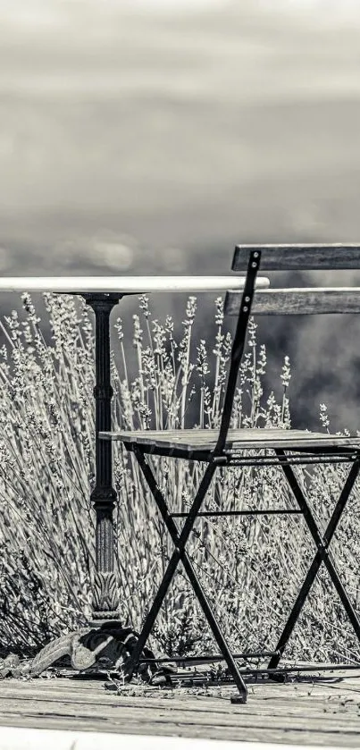 Monochrome outdoor scene with chair and table for mobile wallpaper.