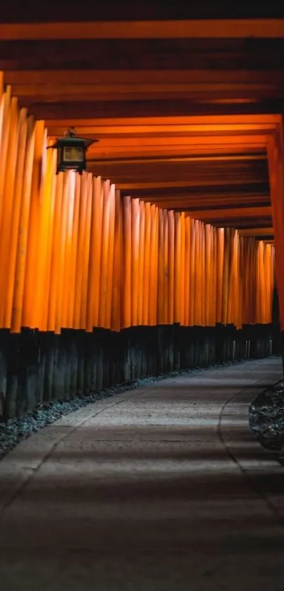 Pathway through vibrant red Torii gates, offering a serene mobile wallpaper view.