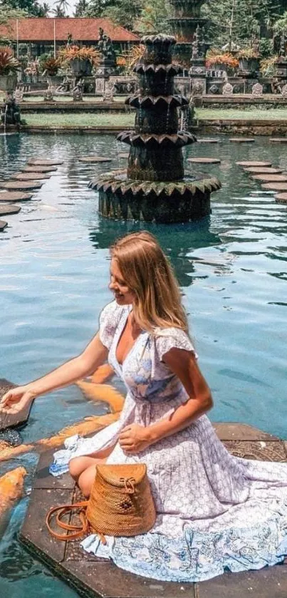 Woman sitting by pond with koi fish in serene garden setting.