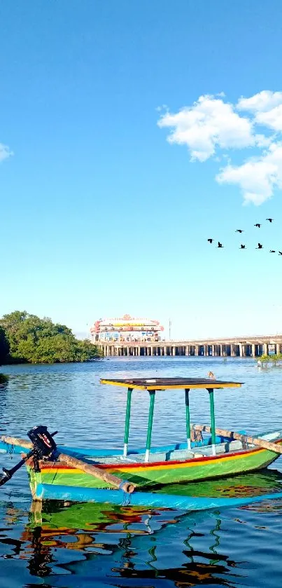 A peaceful river with a colorful boat under a blue sky with birds flying.