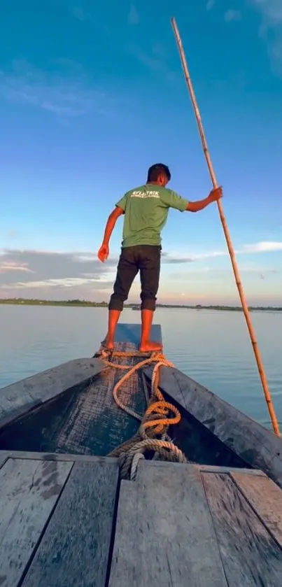 Man standing on a wooden boat at sunset on a tranquil river.