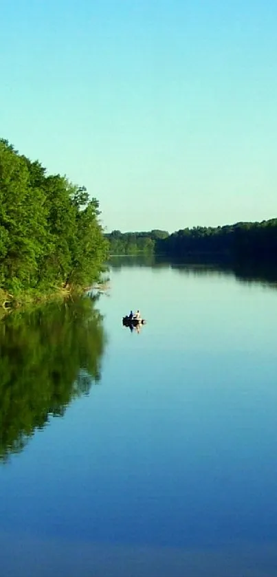 Tranquil river and lush greenery under a bright blue sky wallpaper.