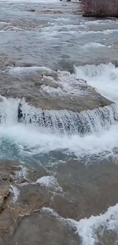 A serene river waterfall with cascading water.