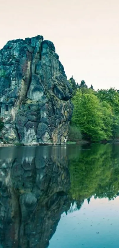 Rock formation with lake reflection and greenery.