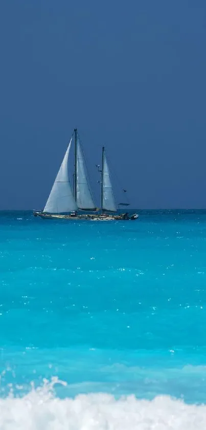 Sailboat gliding on calm turquoise sea under a clear blue sky.