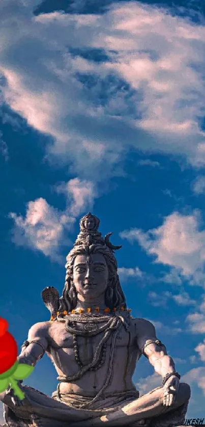 Lord Shiva meditating under a clear blue sky with lush surroundings.