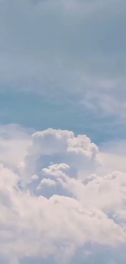 Light blue sky with fluffy white clouds.