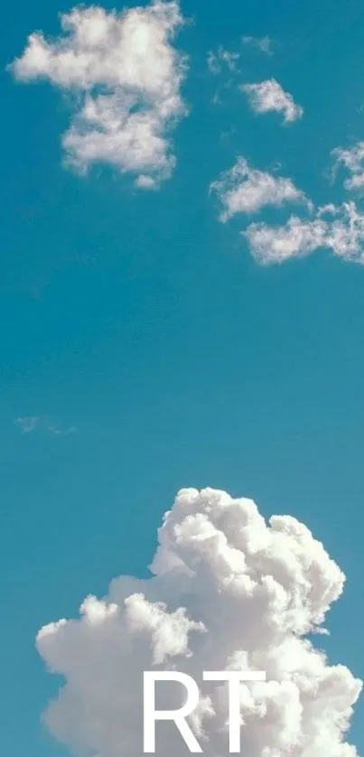 Fluffy clouds in a blue sky, peaceful wallpaper.