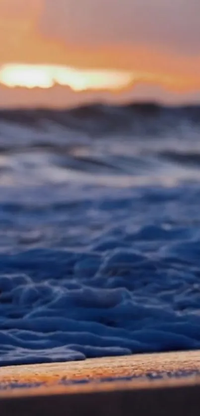 Tranquil ocean waves during sunset at a serene beach.