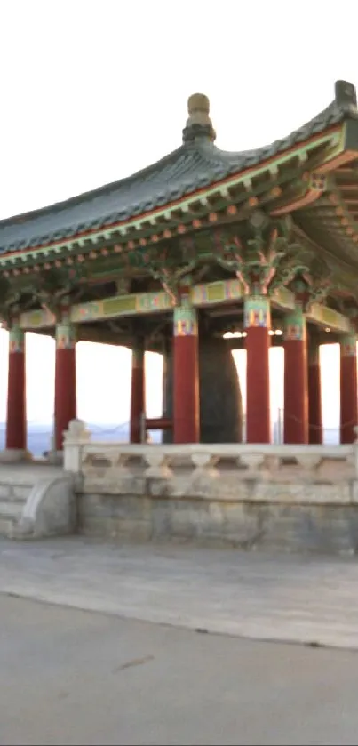 Sunset over traditional gazebo with a serene, peaceful ambiance.