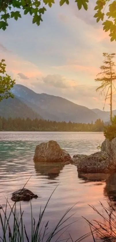 Serene lake at sunset with mountain views.