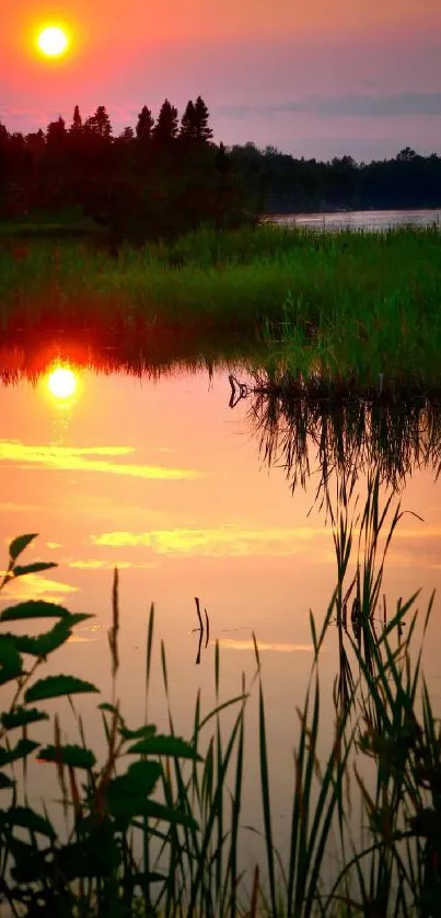 Serene sunset over a tranquil lake with orange skies and vibrant reflections.