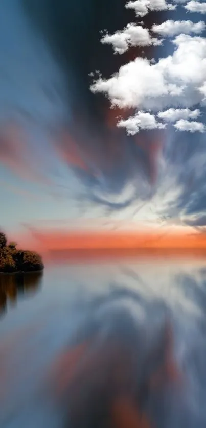 Stunning sunset reflecting on a tranquil lake with clouds and vibrant colors.