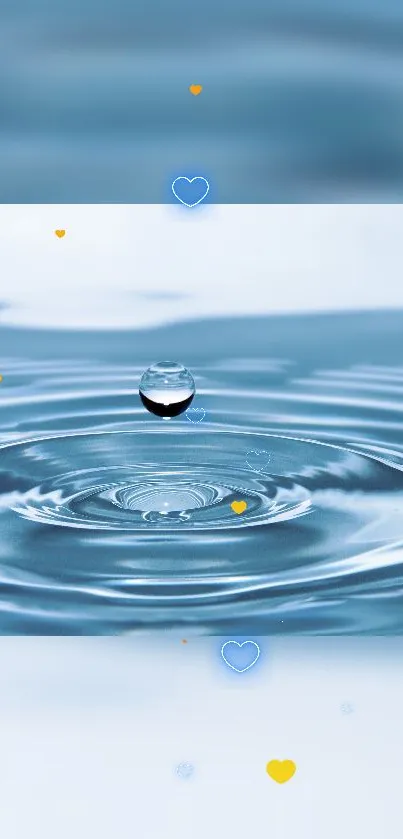 A single droplet creates ripples on a calm blue water surface with small heart shapes.